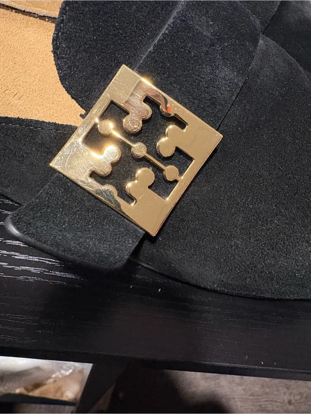 Tory Burch black suede slip-on mules in a size 7.5